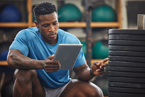 Strength and conditioning coach counting weights